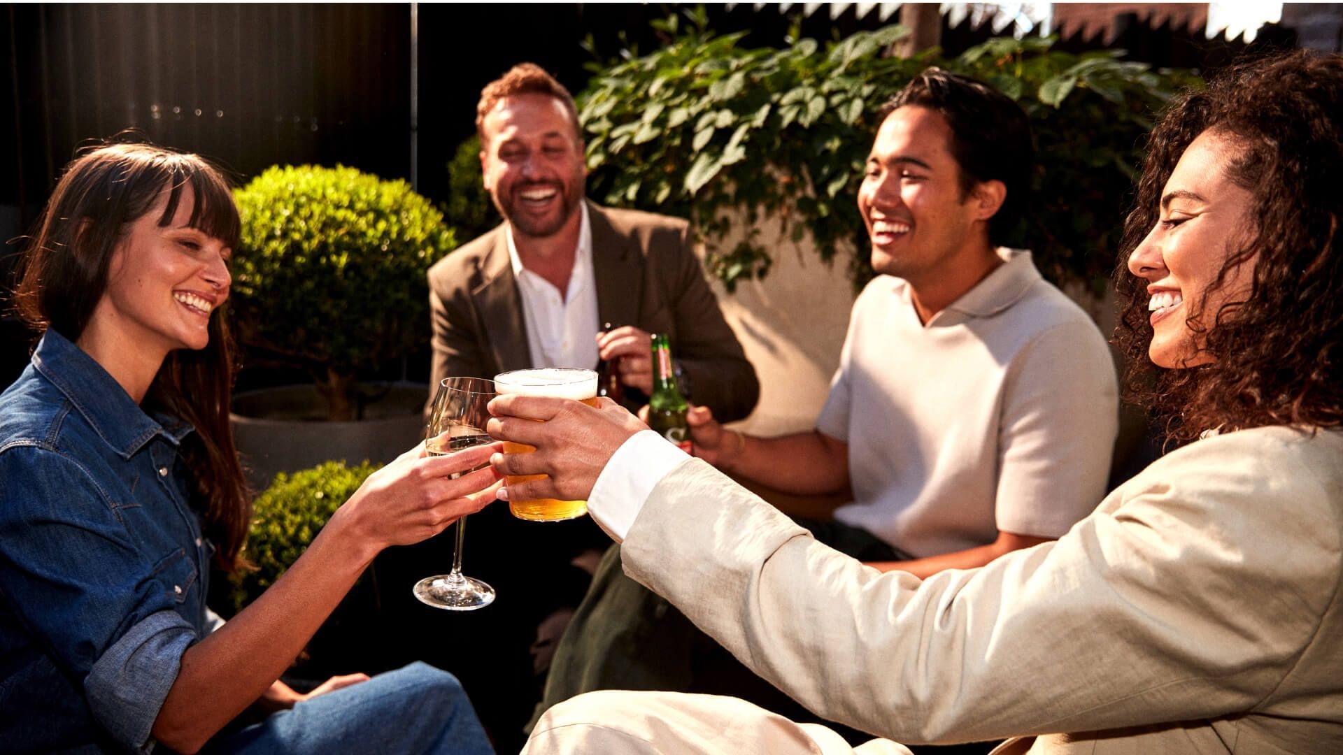 Group of friends cheersing outside