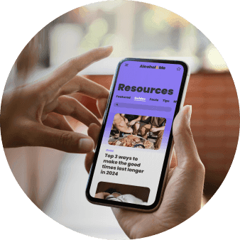 Hold a phone with Alcohol & Me resources on screen